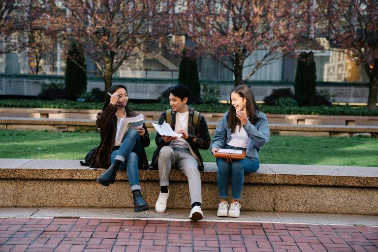 Students sat on a wall
