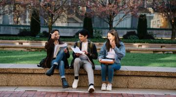 Students sat on a wall