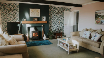 Image of the interior of Crossroads B&B - showing wood burner and cosy interiors.